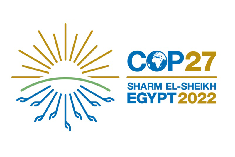 Brown, blue, and green COP27 logo; Sharm el-Sheikh, Egypt 2022.